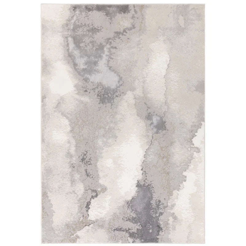 Grey and cream abstract area rug with soft textured pile and modern pattern