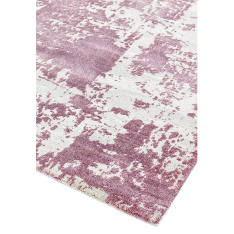 Pink and cream abstract pattern area rug corner close-up