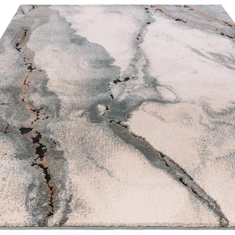 modern abstract area rug with grey and beige marble pattern, low angle view