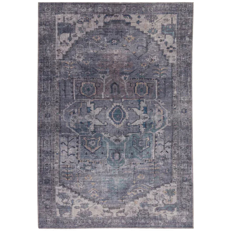 Blue and grey patterned area rug with traditional ornate design and distressed finish