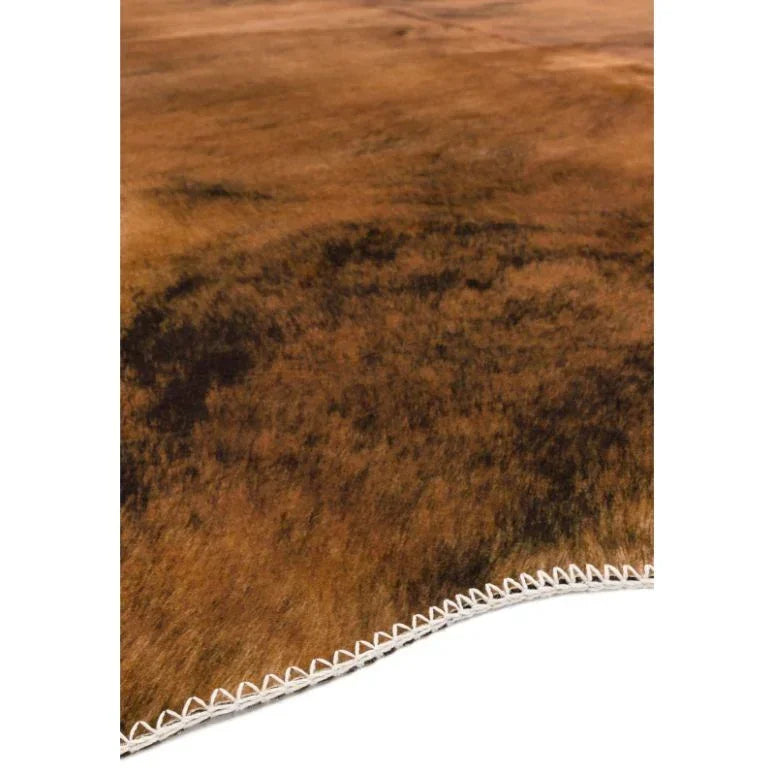 Brown cowhide rug with natural patterns and stitched edge detail