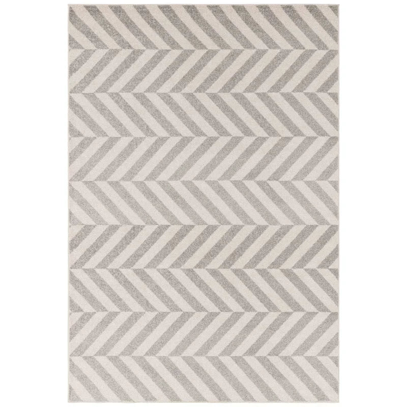 Grey and cream chevron patterned area rug with textured stripes and modern design