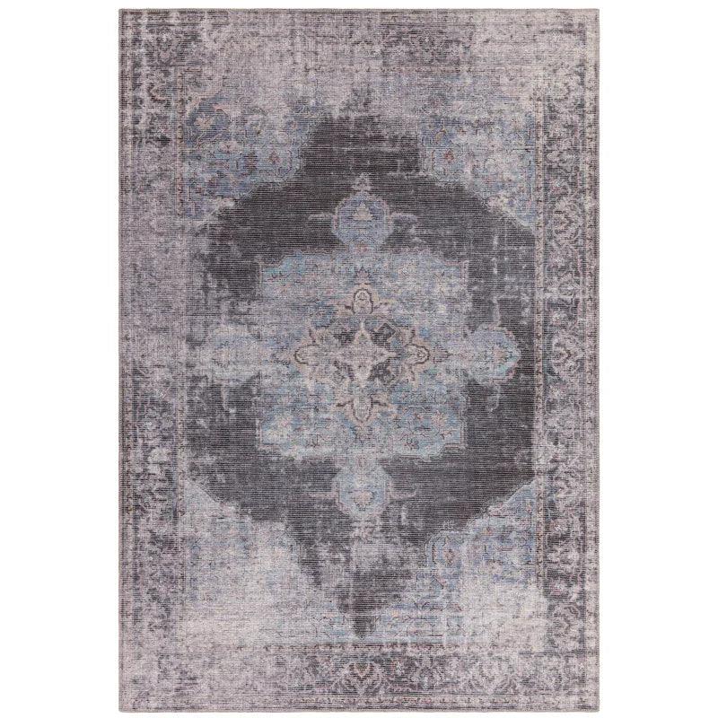 Grey and blue distressed pattern area rug with ornate central medallion design