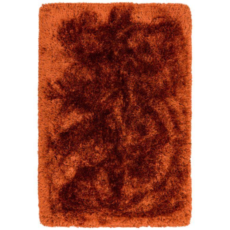Rust fluffy shaggy rug with deep pile texture, rectangular shape, top-down view