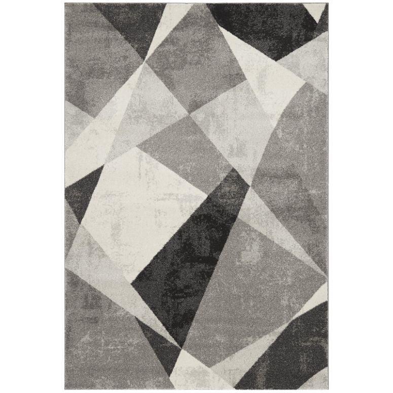 Grey geometric area rug with abstract angular pattern in black, white and grey tones