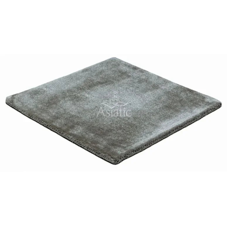 Grey silver rug with soft texture and neatly finished edges, shown from angled view