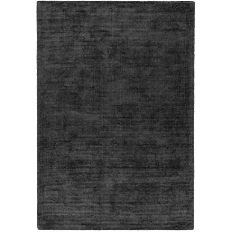 Charcoal grey rectangular area rug with soft textured pile, overhead view