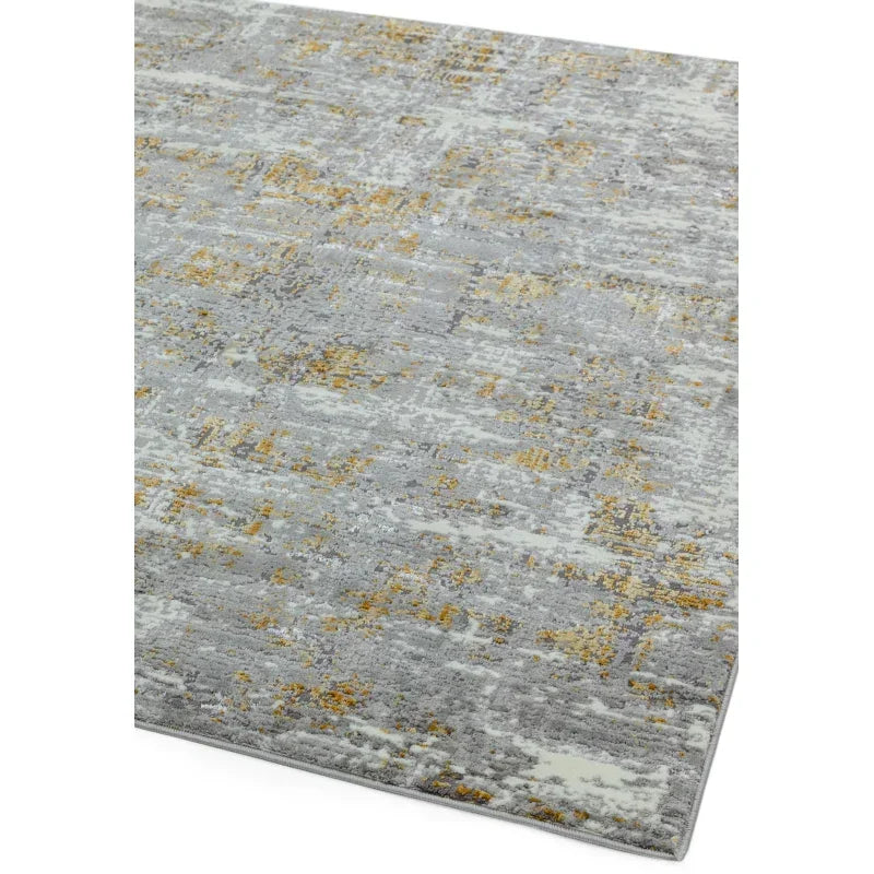 Grey and yellow abstract pattern rug with soft texture, corner angle view