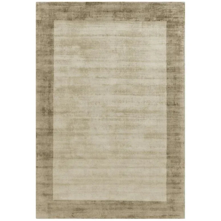 Beige bordered area rug with soft texture and subtle two-tone pattern
