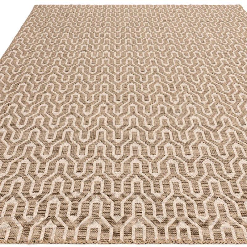 Beige geometric pattern rug with textured woven design, shown from angled top view