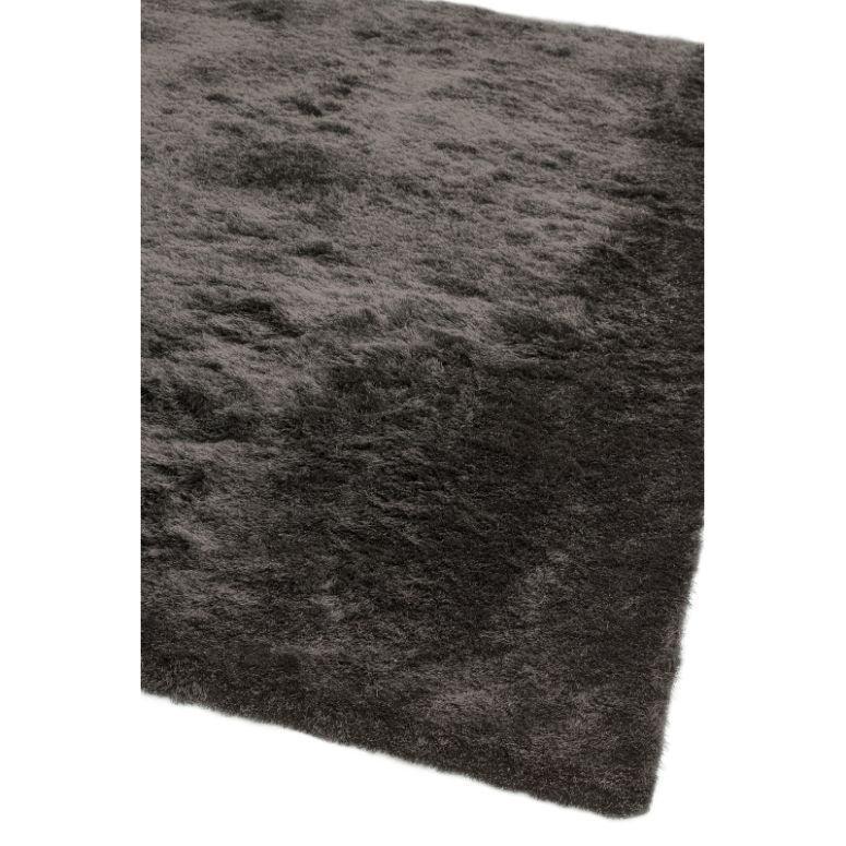 Dark grey shaggy rug closeup showing soft pile and texture