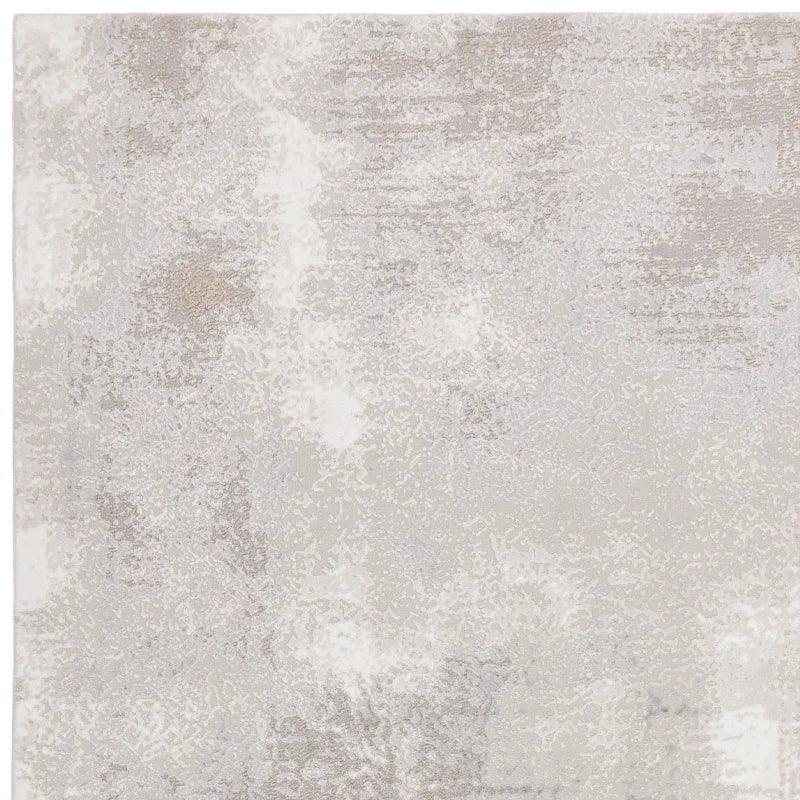 Light grey abstract area rug with subtle textured pattern