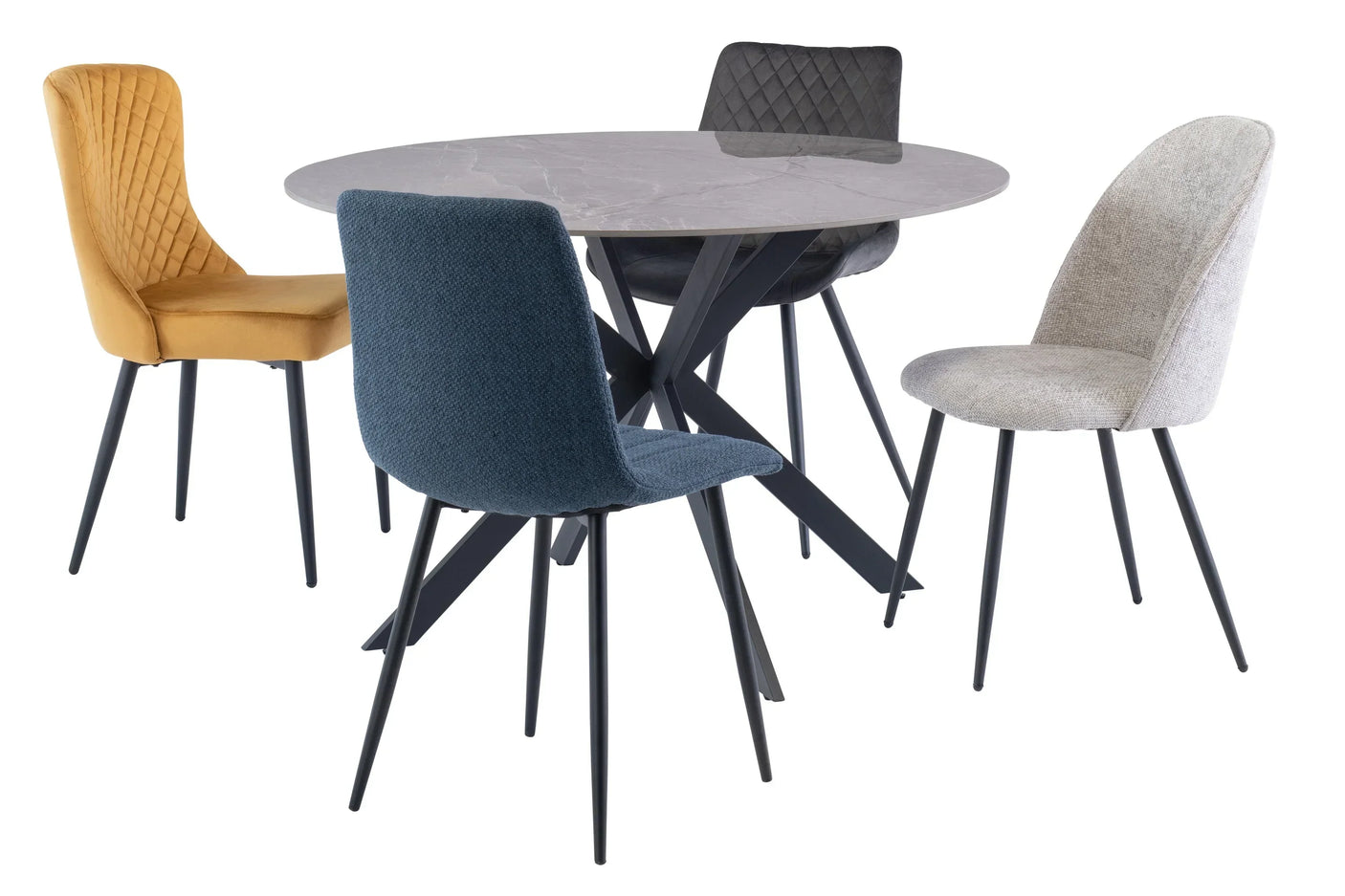 Round marble dining table with four modern fabric chairs in yellow, blue, grey, and cream