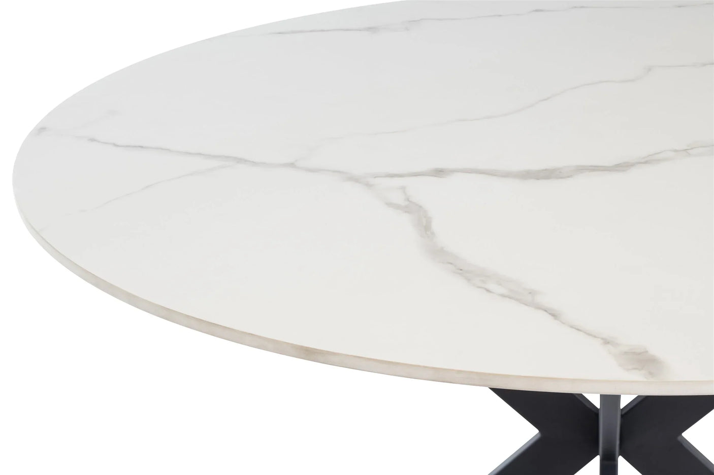 Round ceramic dining table with white marble effect top, close up of surface and edge