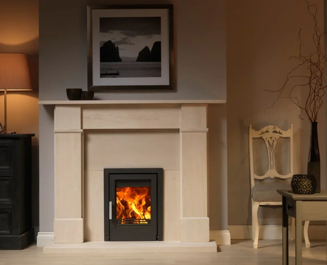 Modern limestone fireplace with wood burning stove in cosy living room setting