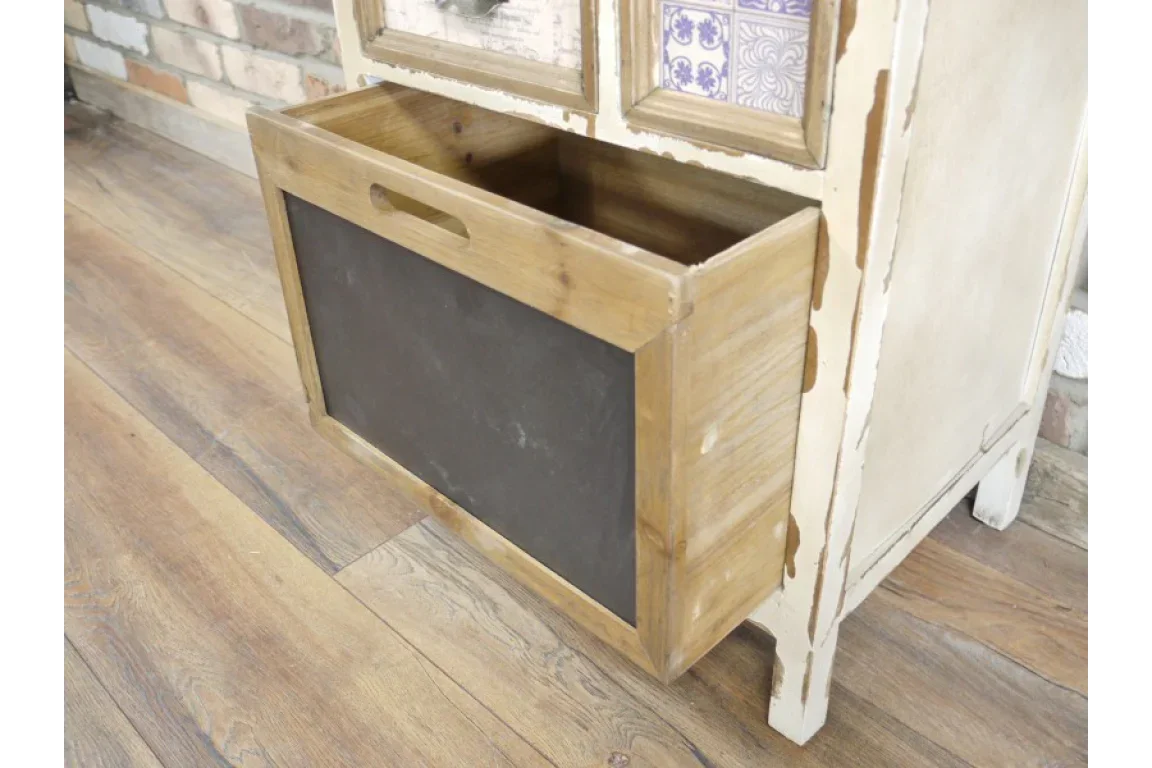 Rustic wood storage unit with black front panel and cutout handle on wooden floor