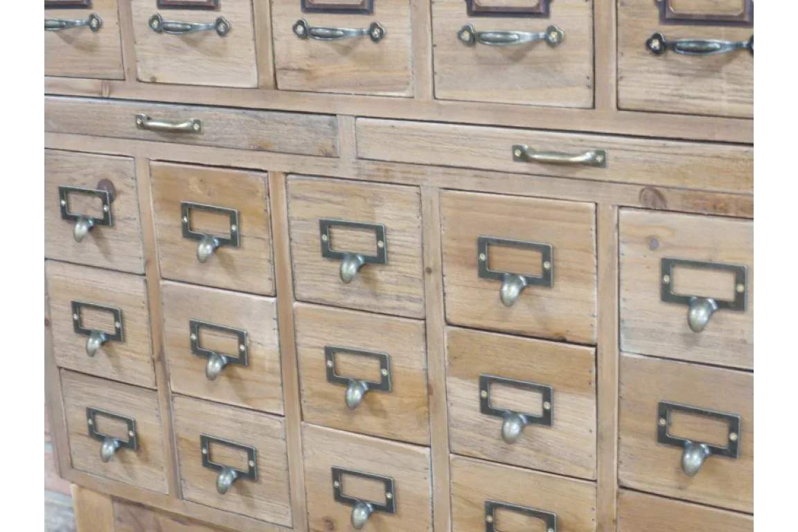Wooden storage chest with multiple drawers and metal label handles