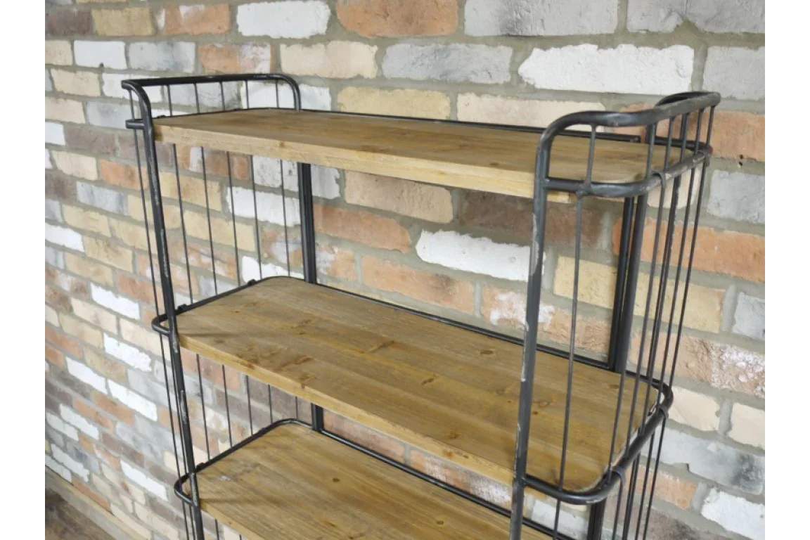 Industrial style shelving unit with wooden shelves and black metal frame against brick wall