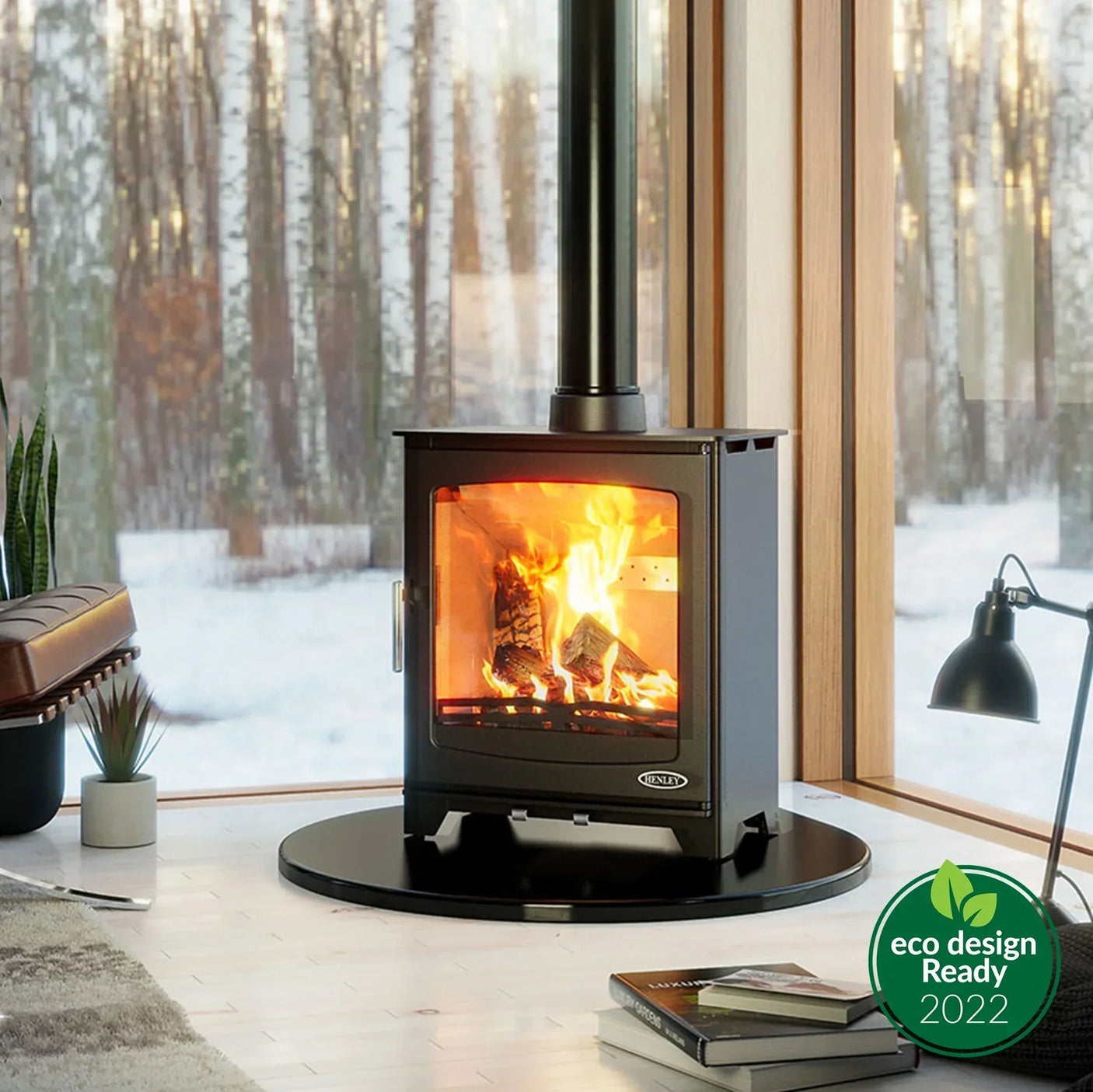 Black wood burning stove with glass door in modern living room, forest view through window