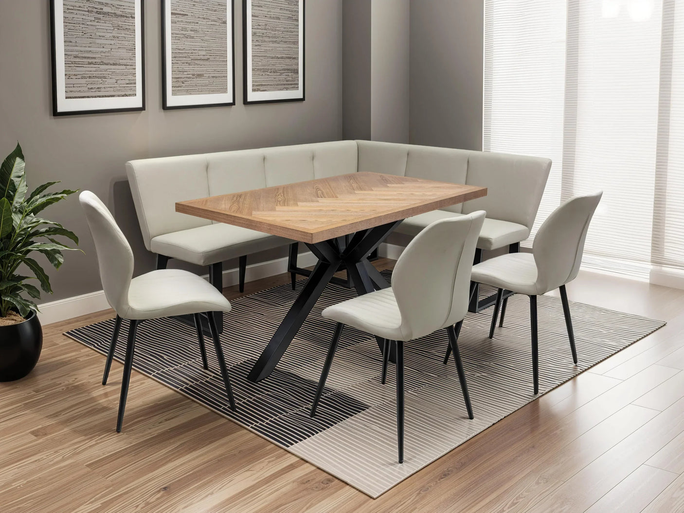 Modern dining set with wooden table, corner bench seating, and cream chairs on striped rug