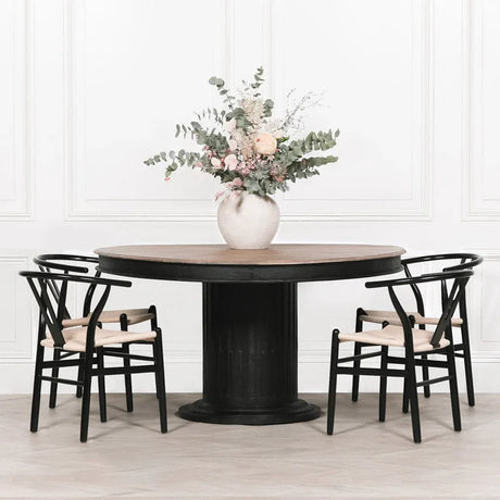 Buy round dining table set with black chairs and floral vase online, modern kitchen furniture