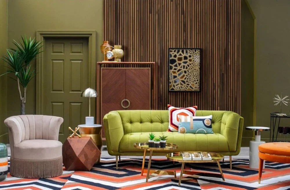 Buy modern living room furniture online, including green sofa, armchair, decor, and geometric rug.