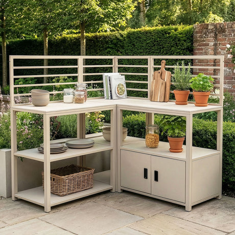 Outdoor kitchen unit with cream metal frame, shelves, storage and potted herbs on patio