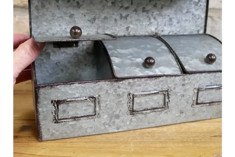 Galvanised metal storage box with three labeled compartments and wooden handles on lids
