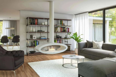 Modern living room with grey sofa, floating fireplace, bookcase, and large window