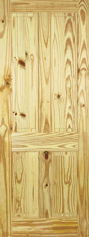 Knotty pine interior door with four panels and natural wood grain pattern