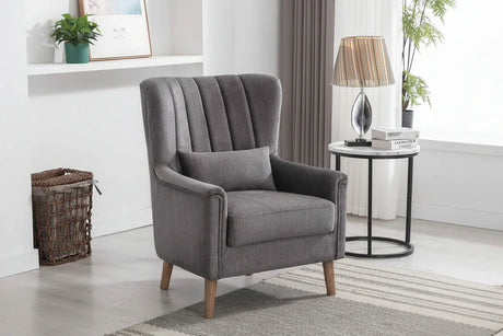 Graphite upholstered armchair with wooden legs beside a round side table in modern living room