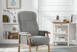 Grey armchair with wooden frame in modern living room setting