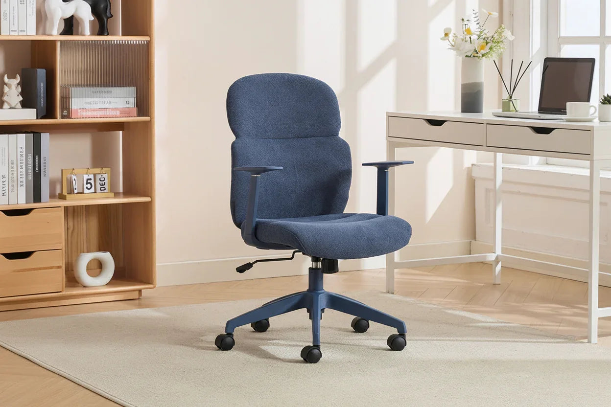Blue office chair with ergonomic backrest and armrests on castors in a modern home office