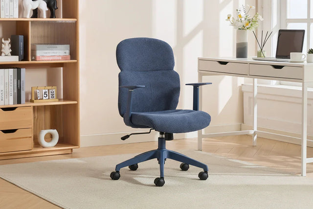 Blue office chair with ergonomic backrest and armrests on castors in a modern home office