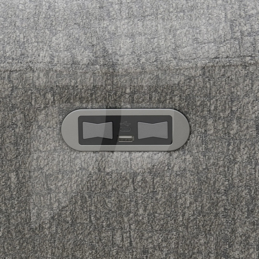 Closeup of grey swivel chair fabric with built-in USB and power control panel