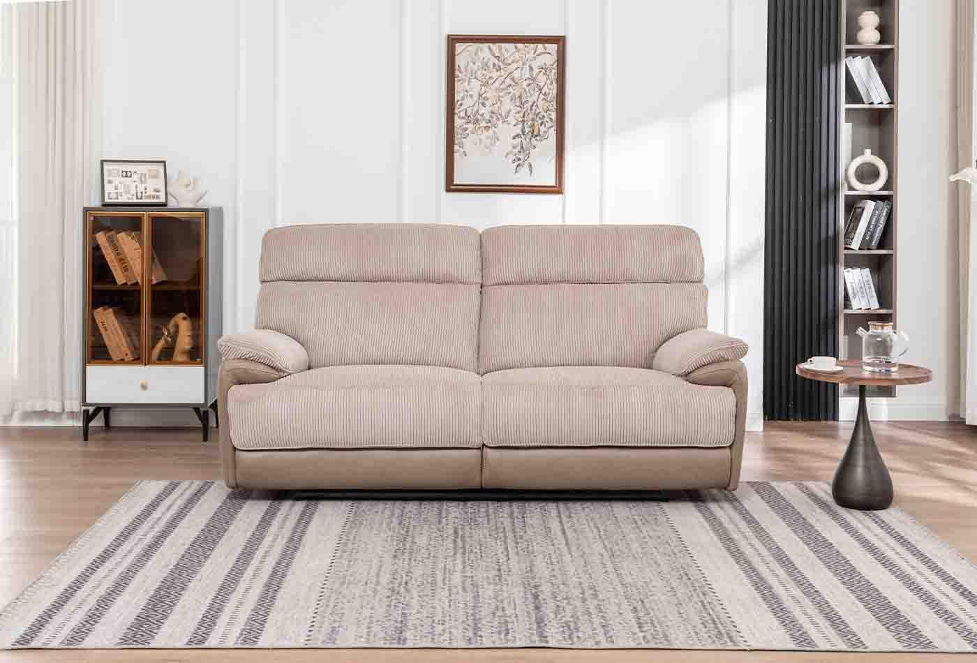 Beige two seater sofa with cord upholstery on striped rug in modern living room