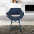 Black viva chair with curved backrest and cut-out seat on patterned rug in modern living room