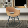 Mustard fabric accent chair with black legs on patterned rug in modern living room