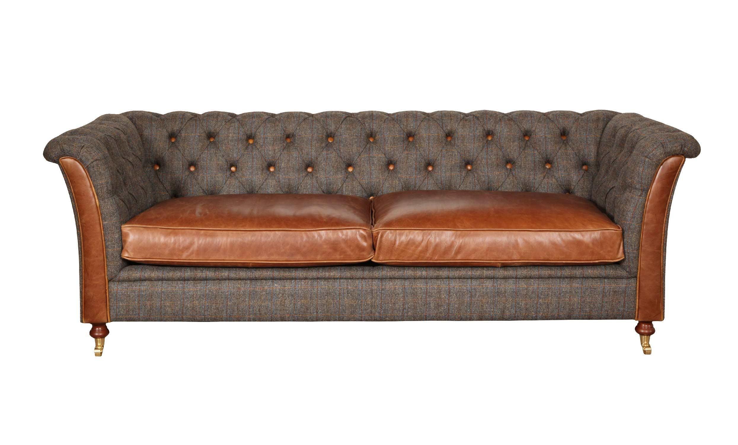 Brown leather and tweed sofa with deep buttoned backrest and wooden legs, front view