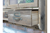 Rustic wooden wall unit with open drawer, metal handle, and label holder, angled view showing textured wood grain.