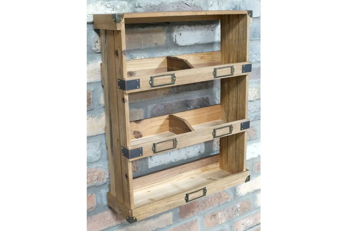 Rustic wooden wall shelf unit with three tiers and metal corner accents, mounted on brick wall