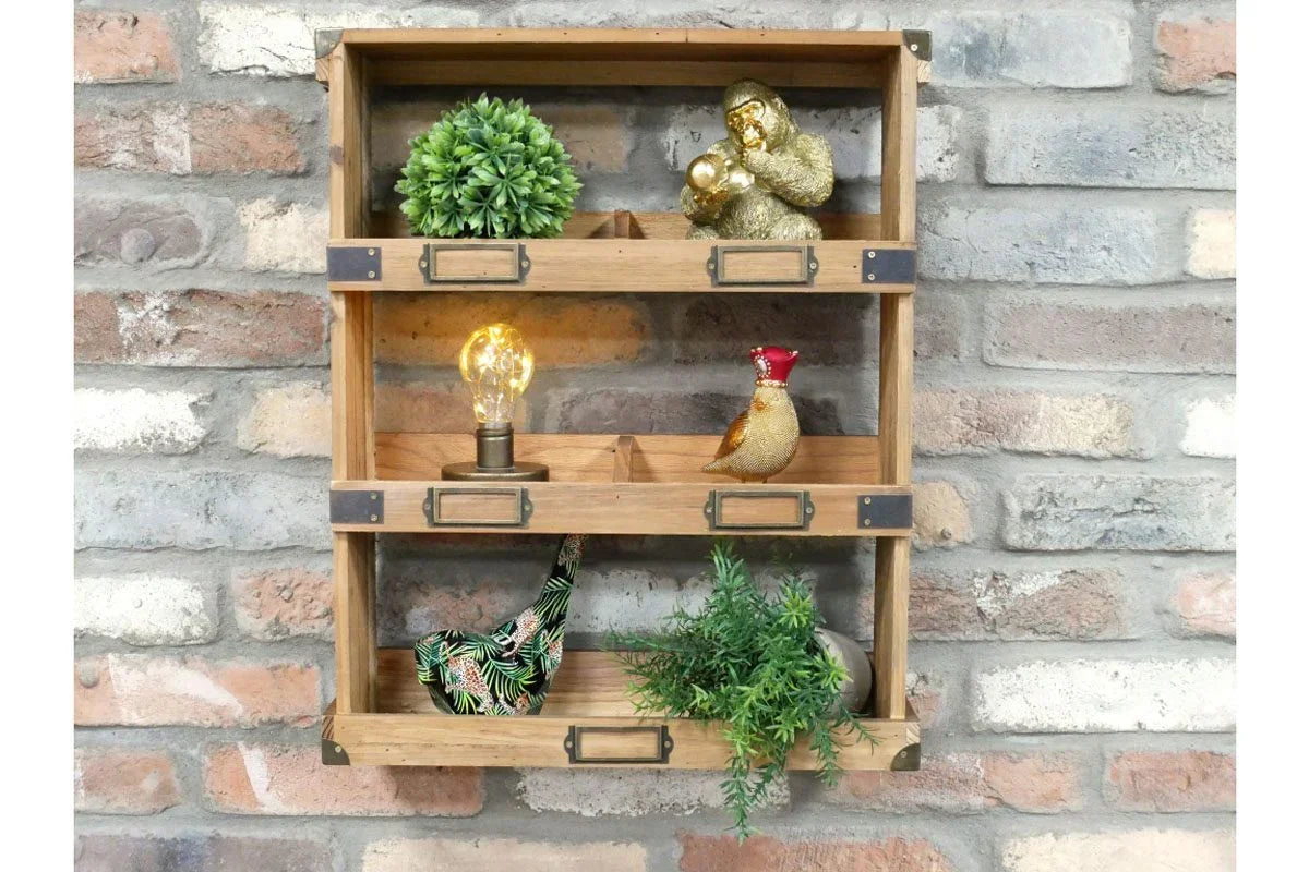 Wooden wall shelf with vintage metal label holders, decorated with plants and ornaments