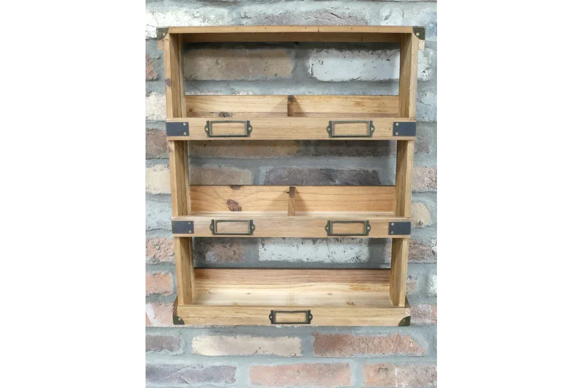Three-tier wooden wall shelf with metal label holders against a brick wall