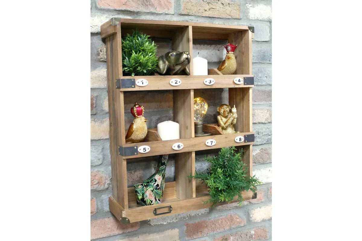 wall-mounted wooden display shelf with eight cubby holes and decorative ornaments
