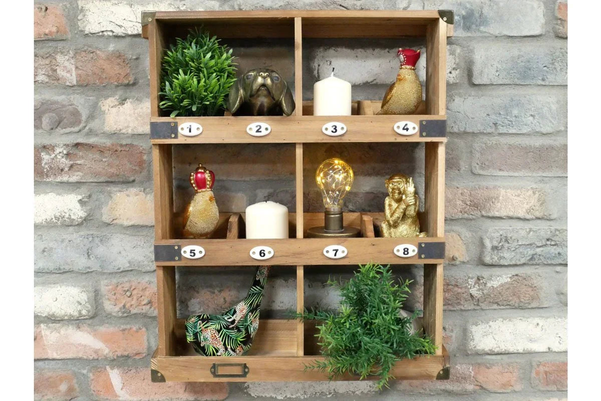 Wooden wall organiser with numbered cubby shelves, home decor ornaments and faux plants
