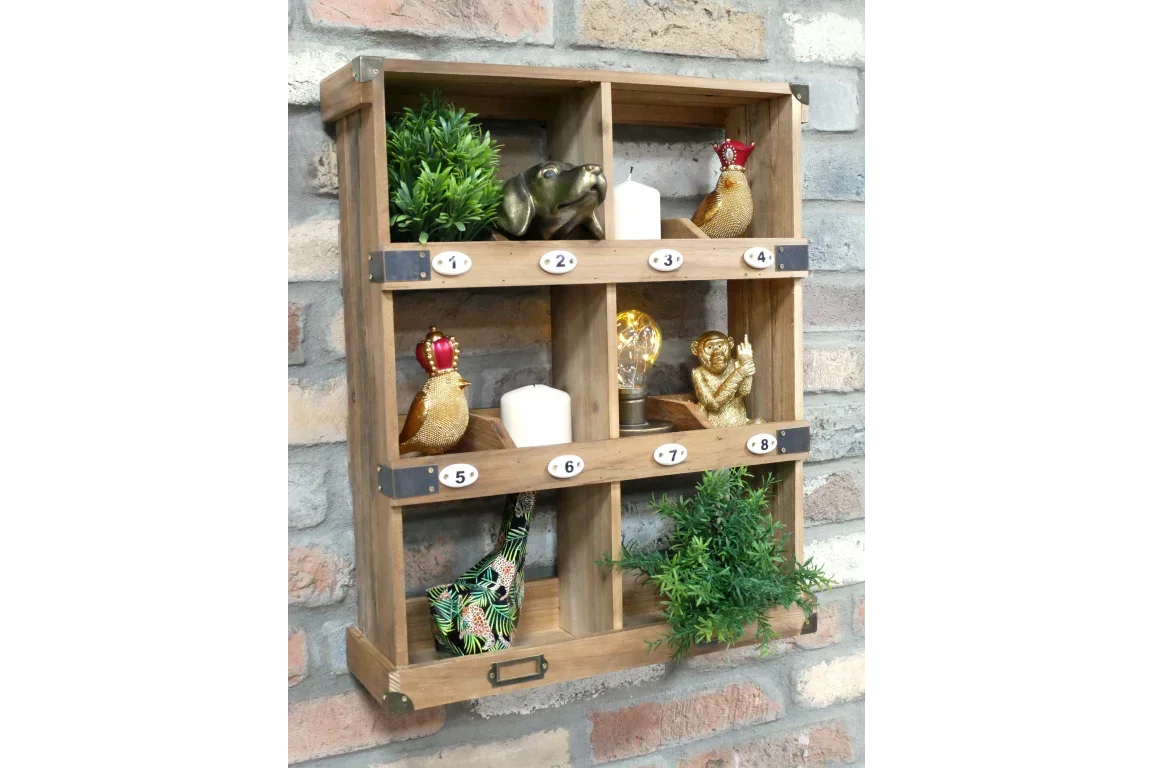 Rustic wooden wall shelf with numbered cubbies decorated with ornaments and faux plants