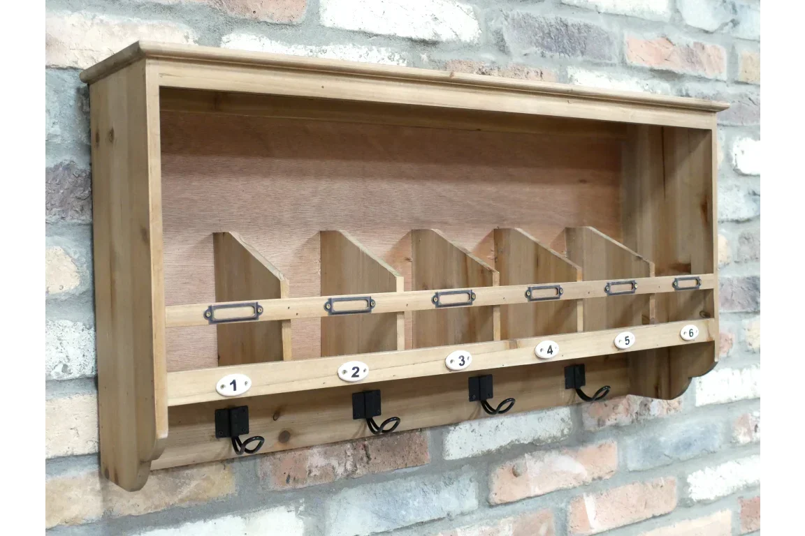 Wooden wall-mounted mail organizer with numbered cubbies and six black metal hooks