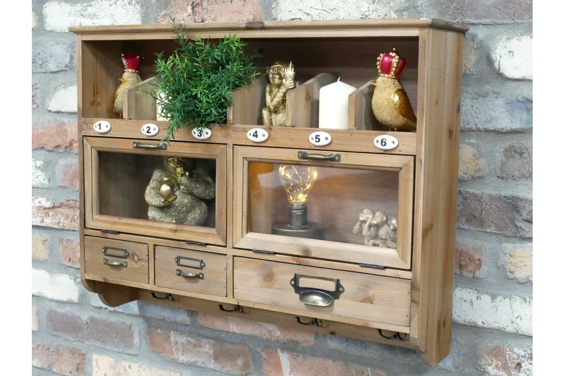 Rustic wooden wall cabinet with drawers and numbered compartments against brick wall