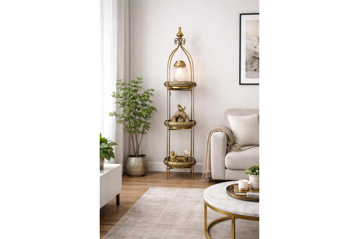 Tall 3 tier gold metal shelves with decorative items, in a neutral living room setting, angled front view.
