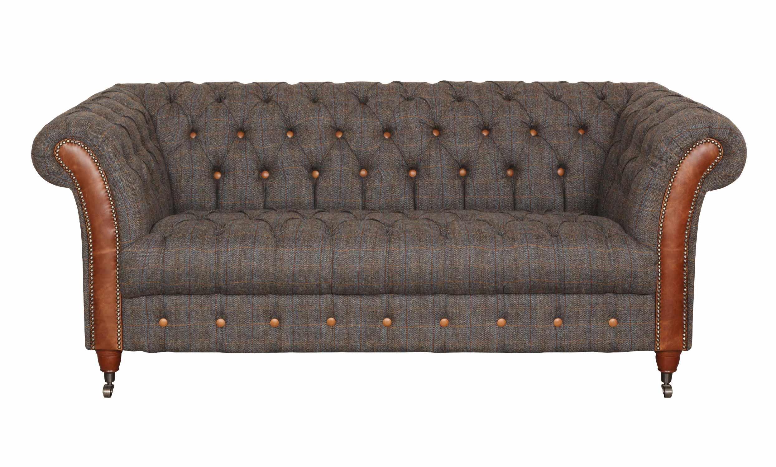 Brown tweed chesterfield sofa with button tufting and leather rolled arms, front view